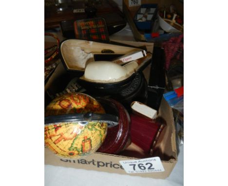 A box of miscellaneous items including pipe etc