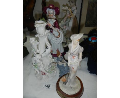 3 figurines and a figural china candlestick
