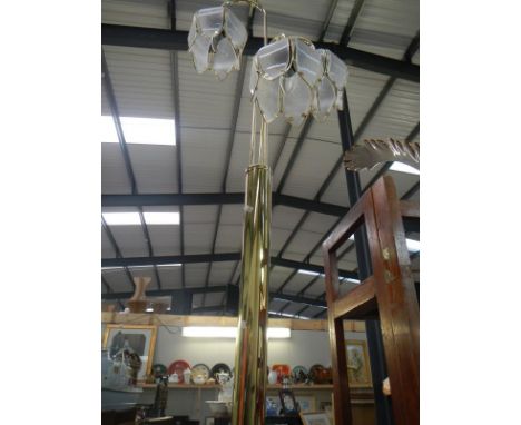 A brass standard lamp with two hanging lights