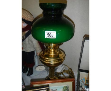 An oil map style electric light with green shade