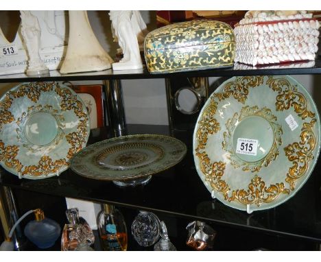 A pair of green glass with gilding plates and a green glass with gilding footed plate