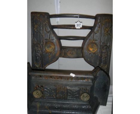 A cast iron fire place front and grate