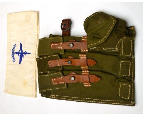 A German Third Reich MP-38 u 40 Ammunition Left Side Pouch, in olive green canvas with three magazine pouches, tan leather st