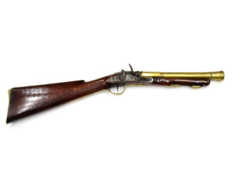 An 18th Century Flintlock Blunderbuss by Newton of Grantham, the 31cm brass two stage barrel octagonal at the breech, with Lo