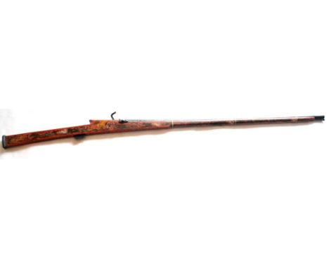 A 19th Century Indian Matchlock Long Gun, the slender 102.5cm steel barrel flared at the muzzle, the breech stamped 15-80, th