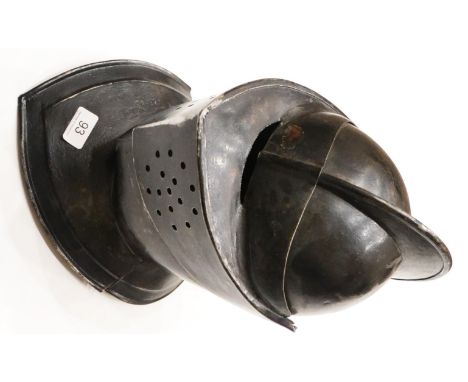 A Copy of a Medieval Close Helmet, in black painted steel, the two piece skull with raised comb, pierced hinged visor, pointe