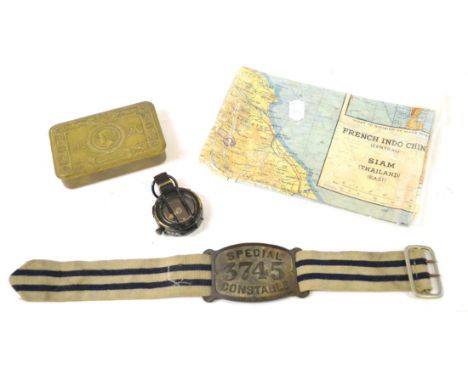 Militaria, comprising:- a Special Constable armband, the blue and white striped webbing strap threading through a rectangular