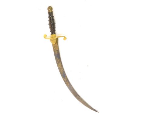 A Georgian Naval Dirk, the 25cm single edge curved blued steel blade engraved and gilt with scrolling foliage and martial tro