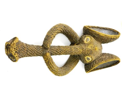 A Bamileke Elephant Head Crest Mask, Cameroon, of carved wood covered in tightly woven vegetable fibre, the oval eyes, nostri