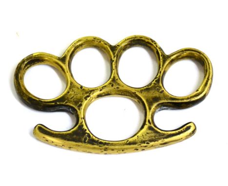 A Brass Knuckleduster, the palm grip stamped with a broad arrow