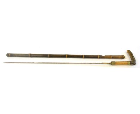 A 19th Century Bamboo Swordstick, with 67cm single edge fullered steel blade, with two nickel collars, curved horn grip and b