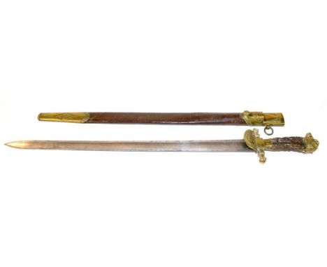 A 19th Century German Hunting Sword, with plain 65cm single edge fullered steel blade, the brass hilt with shell guard cast w