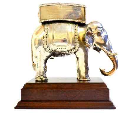 An VIIIth Regiment N.I. Filled Silver Presentation Trophy as an Indian Elephant, standing carrying a double compartment trunk