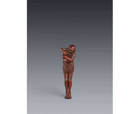 Netsuke des stehenden ashinaga. Holz. Spätes 19. Jh.Sign.: YoshihideDer langbeinige Insulaner steht mit den Füßen eng zusamme