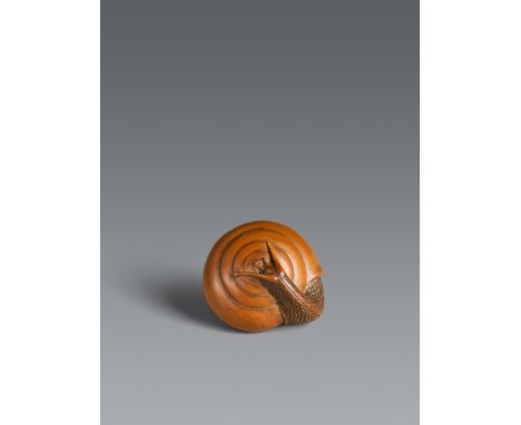 Netsuke einer Schnecke. Helles Buchsbaum. Ise-Yamada. 19. Jh.Sign.: MasakatsuAus ihrem Gehäuse gekrochen, liegt sie mit schla