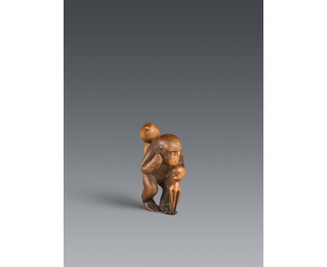 Netsuke eines Affen mit Kalebasse und Oktopus. Buchsbaum. Spätes 19. Jh.Unter der Last der Kalebasse gebeugt auf den Hinterbe