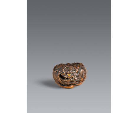 Netsuke eines Drachen in mikan. Buchsbaum. Tanba. Mitte 19. Jh.Sign.: Hidari Toyamasa (Naitō Toyomasa II., 1811-1883)In den b