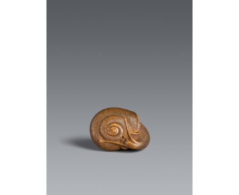 Netsuke einer Schnecke in der Art von Shigeharu. Buchsbaum. 19. Jh.Sign. in ukibori: Odawara jū YoshiharuFast gänzlich aus ih