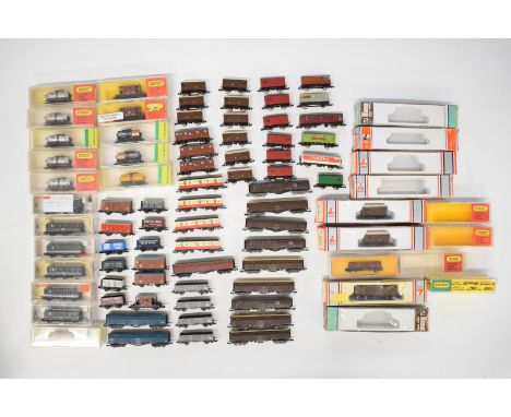 Seventy-eight Hornby Minitrix, Fleischmann and LIma N gauge model railway wagons, most in boxes.