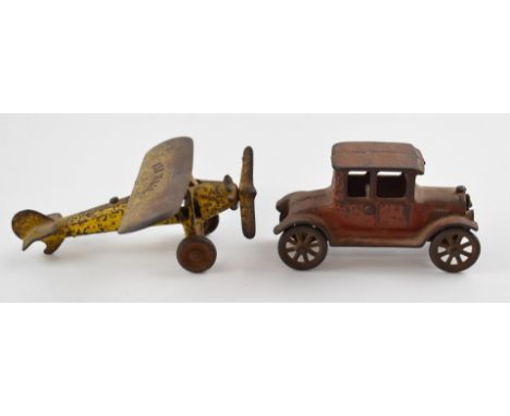 Kenton Toys, Ohio cast iron 'Air Mail' aeroplane and a similar Model T Ford (unmarked)