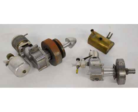 Two vintage compression ignition or diesel model pylon racing or similar model engines, one stamped Cygnet, height of larger 