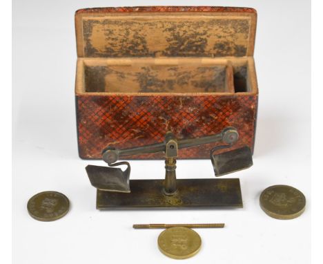 Novelty miniature coin balance or beam scales with three 1821 Royal Mint coin weights, housed in a tartanware box, length 8.5