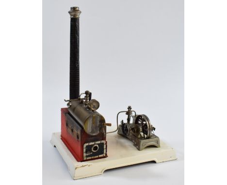 Doll &amp; Co. live steam stationary engine on base, the boiler having faux brick chimney, whistle and pressure gauge, the sl