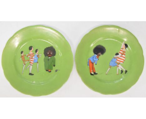 Florence K. Upton pair of Golly Dutch Doll Nursery China tea plates (c1900) transfer decorated in colour with scenes of Golli