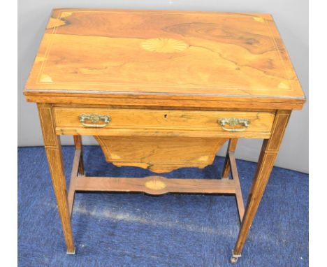 19thC inlaid rosewood games and work table, the fold over top having chess and backgammon boards, with fitted drawer below an