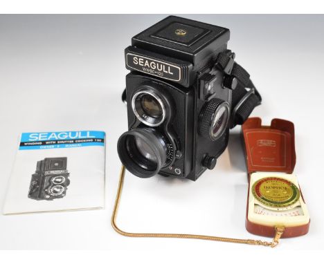 Seagull WWSC-120 TLR camera with owner's manual and a Zeiss Ikon meter