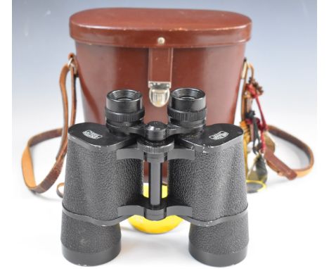 Pair of Carl Zeiss Jenoptem 7x50W binoculars, in original leather case with various 1980s horse racing enamel and other badge