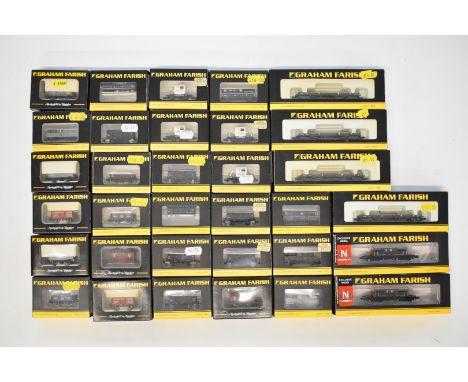 Thirty-three Graham Farish N gauge model railway wagons including SR Queen Mary brake vans and GWR bogie bolster, all in orig