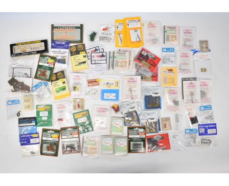 Collection of N gauge model railway accessories including figures, animals and accessories