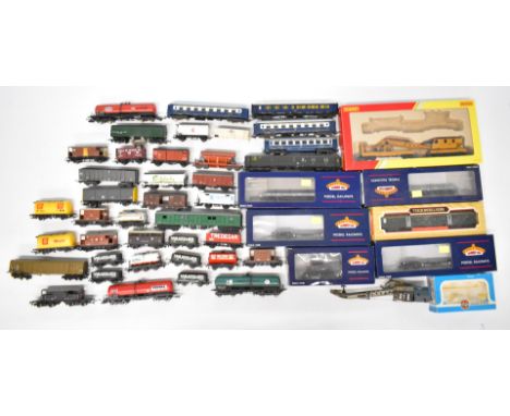 A collection of 00 gauge passenger carriages and rolling stock to include Hornby, Bachmann and others, some in original boxes