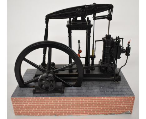 Live steam model beam engine, with dummy flyball governor, single double acting cylinder and spoked flywheel, on faux brick b