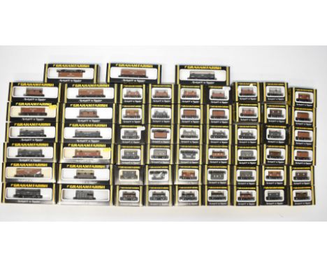 Fifty-seven Graham Farish GWR, LNER, LMS and SR N gauge model railway wagons including brake vans, all in original boxes.
