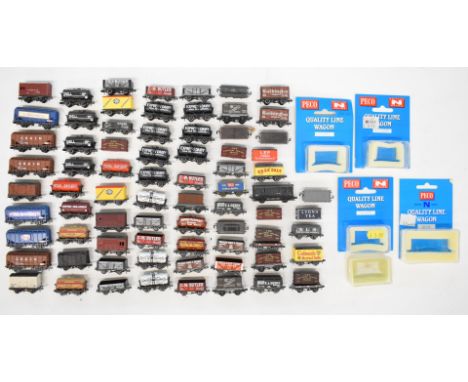 Sixty-eight Peco N gauge model railway wagons including conflat and tanker, some in original boxes.