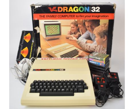 Dragon 32 family computer together with joysticks, manual and a selection of games, all in original boxes.