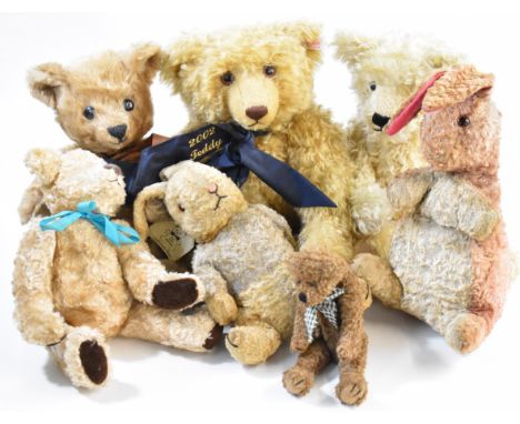 A collection of seven Teddy bears to include a Steiff 2002 Jubilee bear with scarf and button in ear.