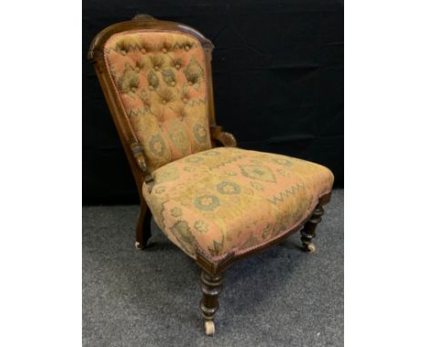 A late Victorian mahogany button-back nursing chair, turned legs, ceramic casters, c.1890. 