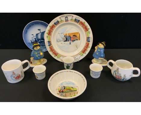 A Wedgwood Peter Rabbit nursery ware;  Coalport Paddington the Chimney Sweep;  another, Paddington Shopping;  Royal Copenhage