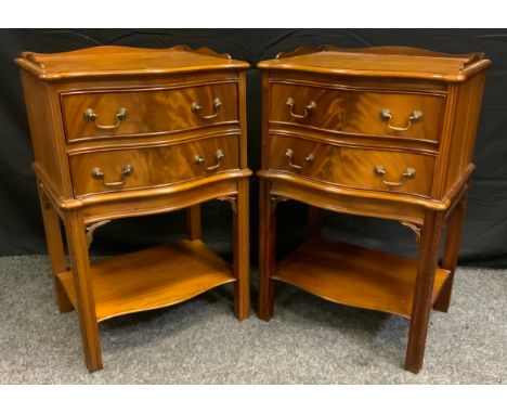 A pair of reproduction mahogany bedside cabinets, each with three quarter galleried top, serpentine fronts, pair of drawers w