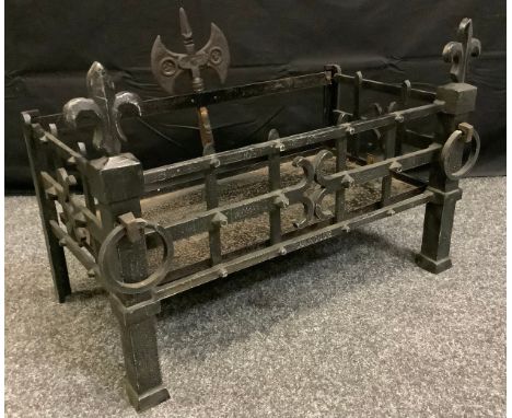 A cast iron fire basket, fleur de lys and ring drop front, axe head back, 45cm high, 65cm wide, 38cm deep. 