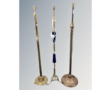 An antique twist column standard lamp together with two further standard lamps 
