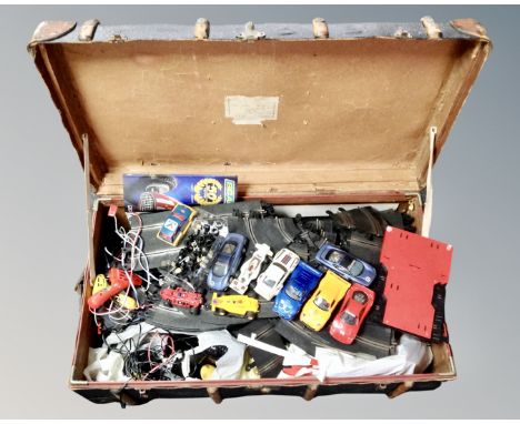A 20th century bentwood bound trunk containing a large quantity Scalextric items, cars track and accessories 
