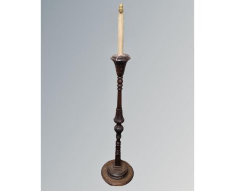 A 20th century carved beech standard lamp 