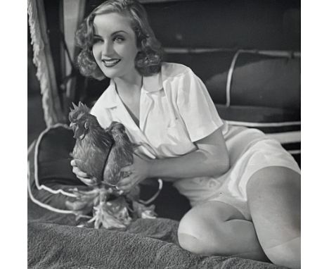 Vintage 1936 Nitrate negative of Carole Lombard with a rooster, then fiance of Clark Gable, they raised farm animals on his p