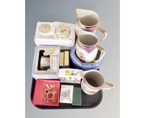 A tray of Wedgwood Beatrix Potter collectables, Royal Doulton Whinnie the Pooh mantel clock, Ringtons caddy, transfer printed
