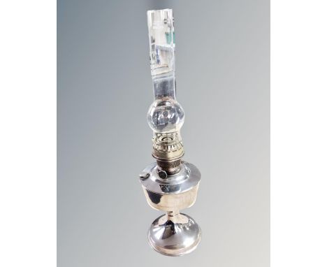 An Alladin chrome oil lamp with chimney 