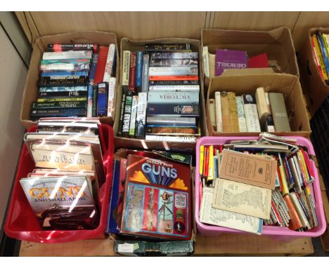 A pallet containing seven boxes of books relating to guns, history, Churchill, Ordnance Survey maps etc 